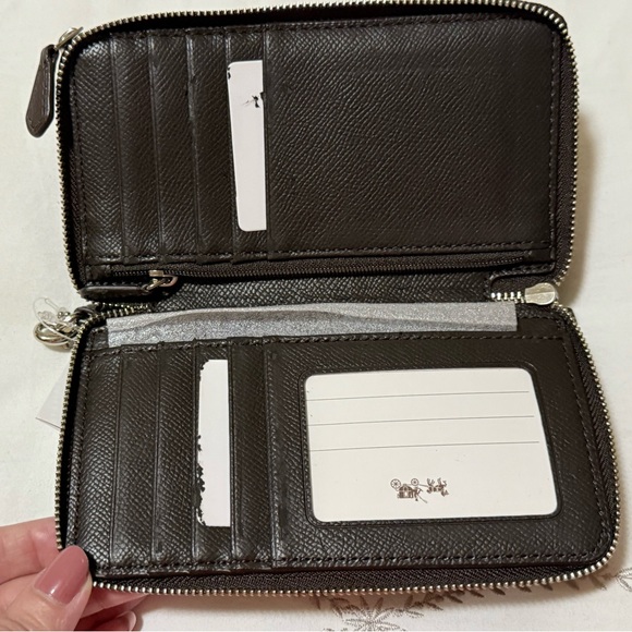 Coach Tan and Brown Signature Wristlet with defects. - Picture 3 of 5